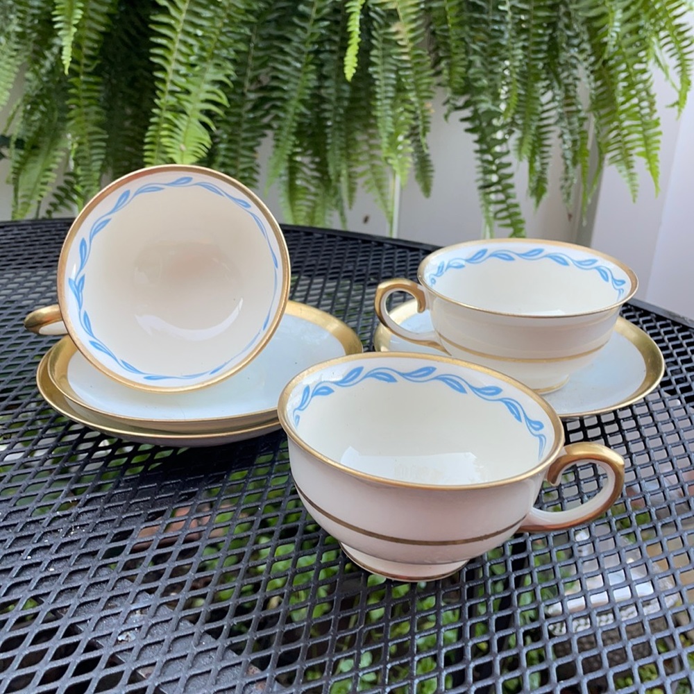 Gold trim tea cups. Ivory porcelain with Blue vine